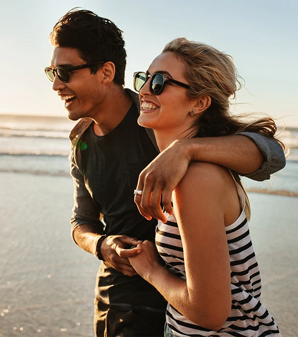 Happy couple with arms around each other