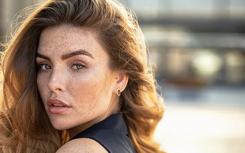 Freckled woman with beautiful lashes