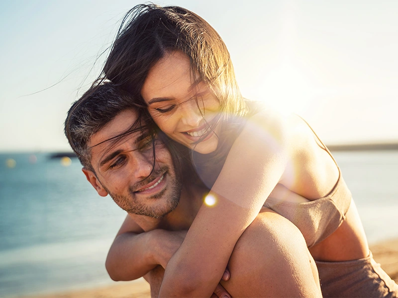 Happy attractive couple by the seaside