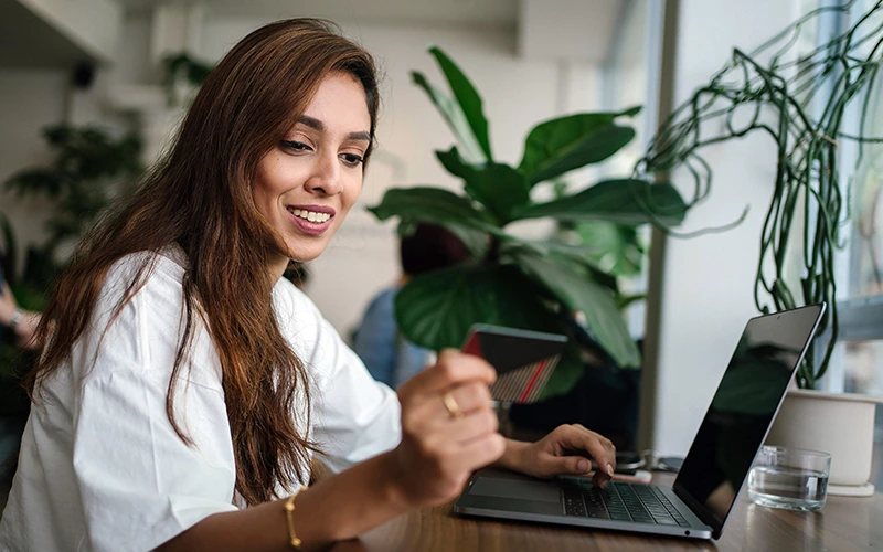 Woman using credit card to make payments