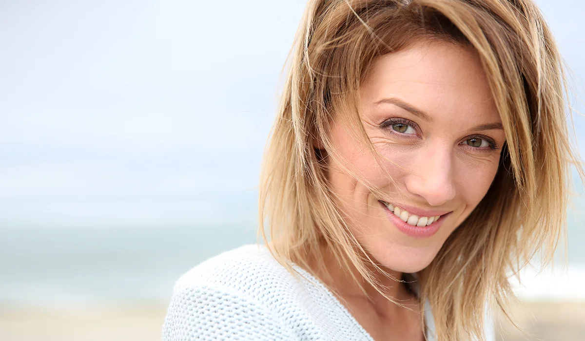 youthful middle-aged woman on the beach