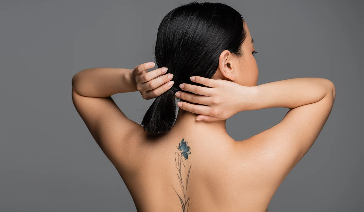 Woman with tattoo on her back