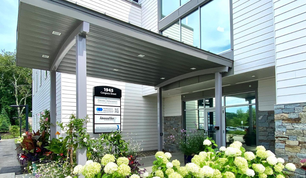 Entrance to building with white hydrangea flowers