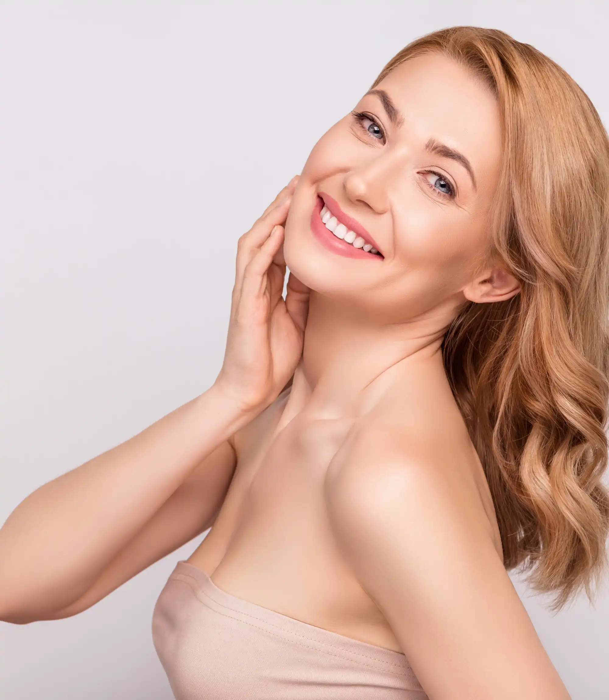 gorgeous woman smiling after Sculptra treatment at CEC of NE