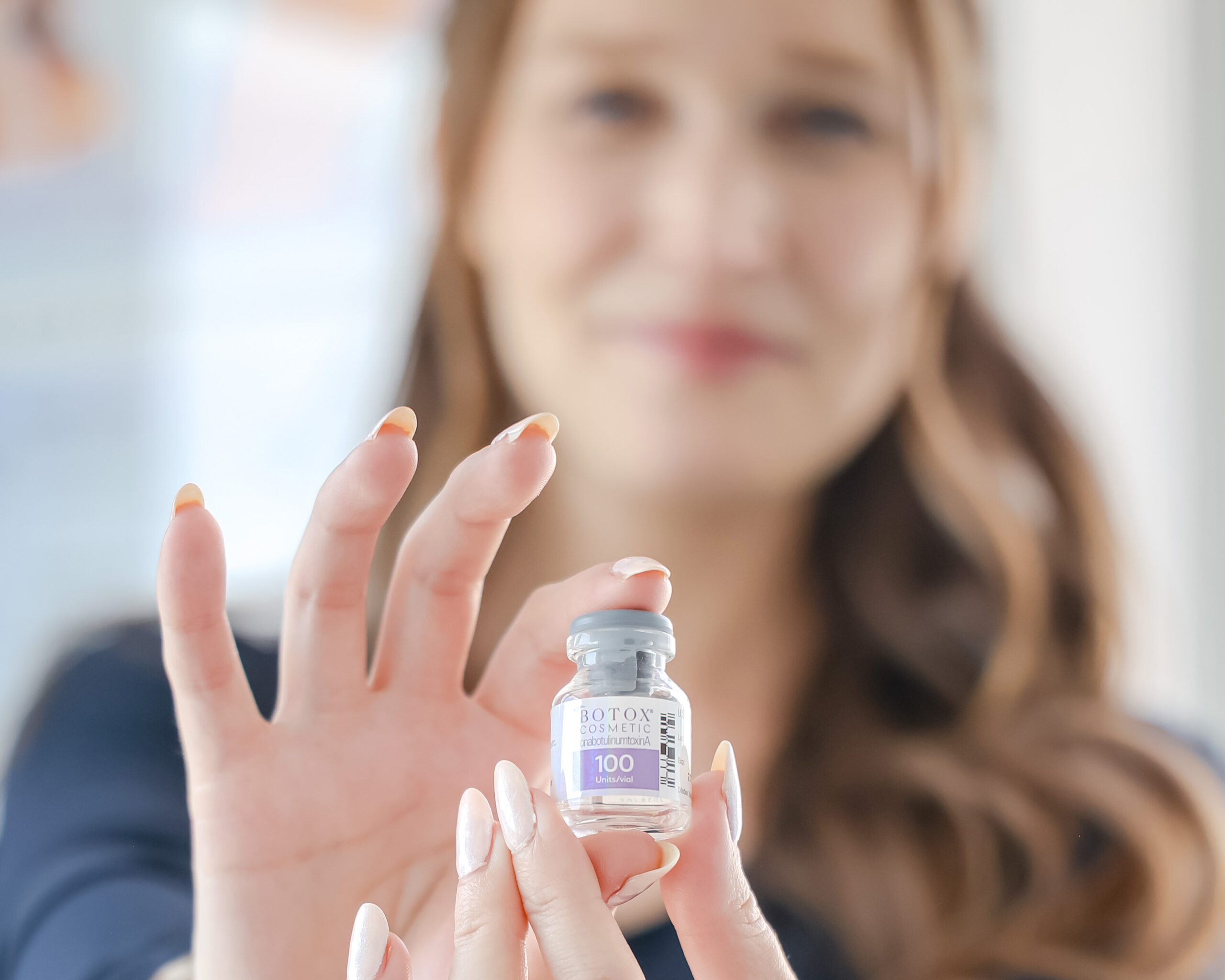 Pretty Female holding Botox